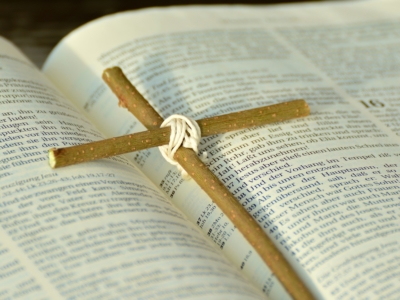 handmade cross on Bible