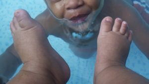 face and feet in pool