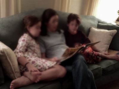 Mother reading to children